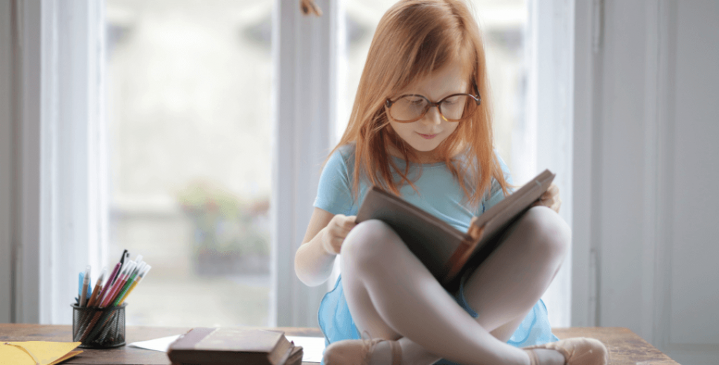 A kid reading a book
